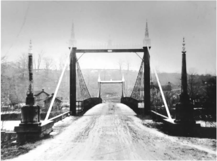 Historic black-and-white photograph looking across the ornate Branch Hill suspension bridge near Loveland, Ohio